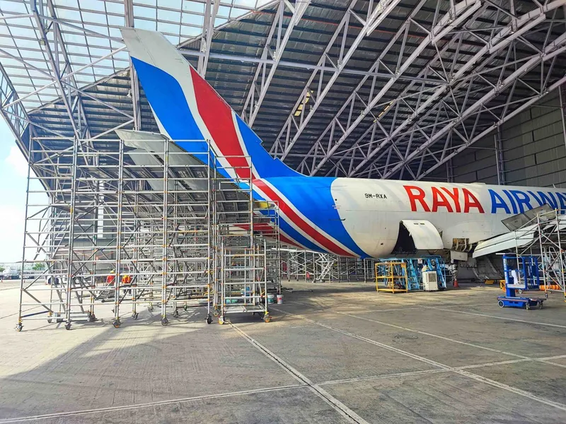 Scaffold at the tail of a Raya Airways aircraft