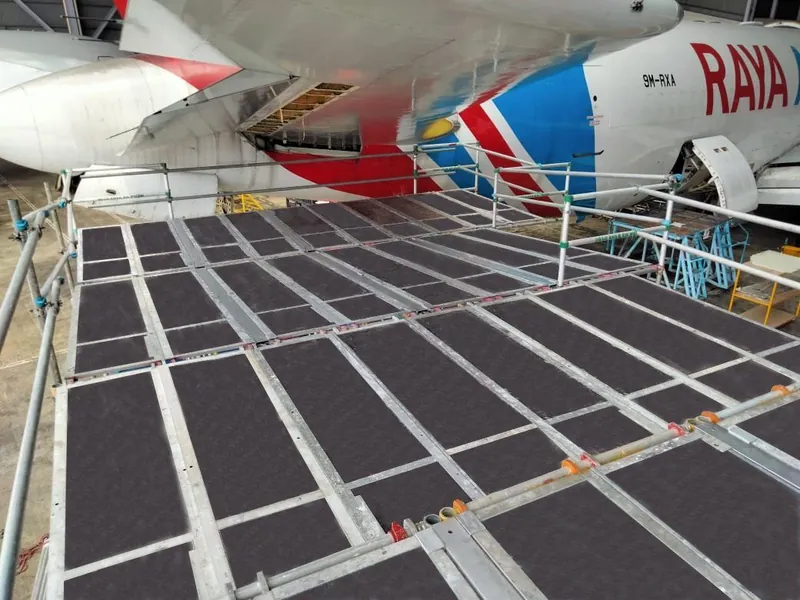 Scaffold deck under a Raya Airways wing
