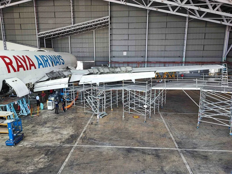 Scaffold under a Raya Airways wing