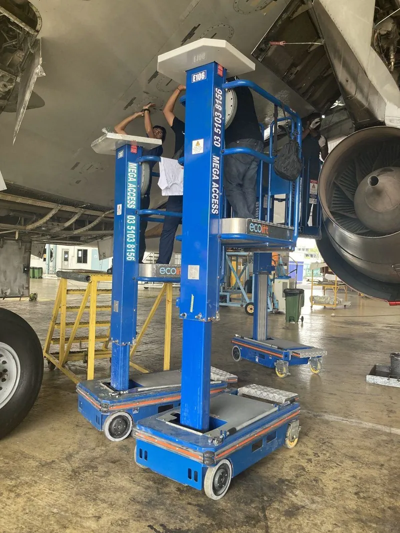 Two Mega Pecolifts under an aircraft engine