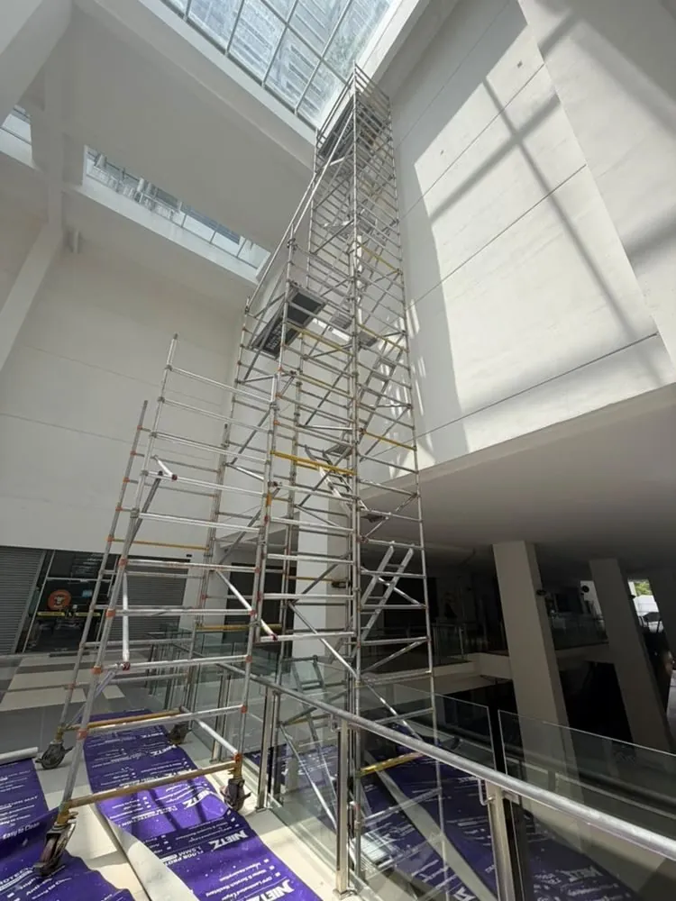 Tall tower in a skylit atrium at Eve Suite