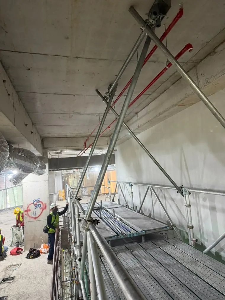 Crew working beside the SuperBridge deck at Maybank