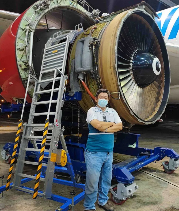 Engine stand beside a jet engine