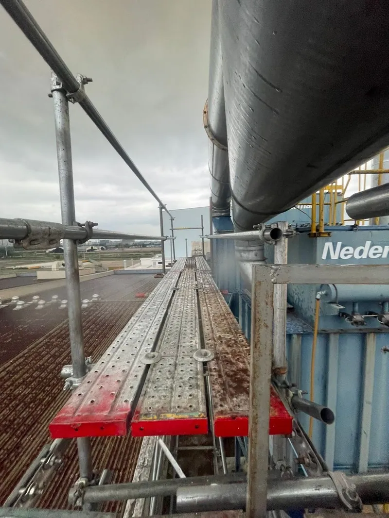 Walkway along rooftop ducts